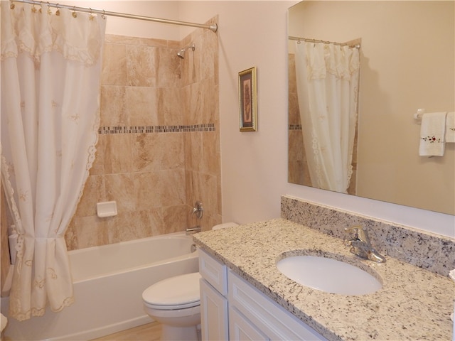 full bathroom with shower / bath combo with shower curtain, vanity, and toilet