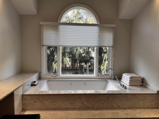 bathroom featuring a relaxing tiled tub