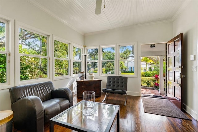 sunroom / solarium featuring ceiling fan