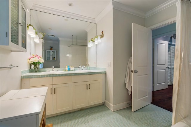 bathroom with walk in shower, ornamental molding, and vanity