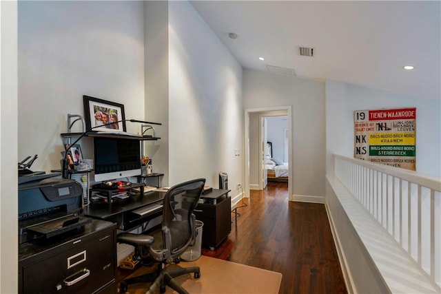 office area featuring dark wood-type flooring and lofted ceiling