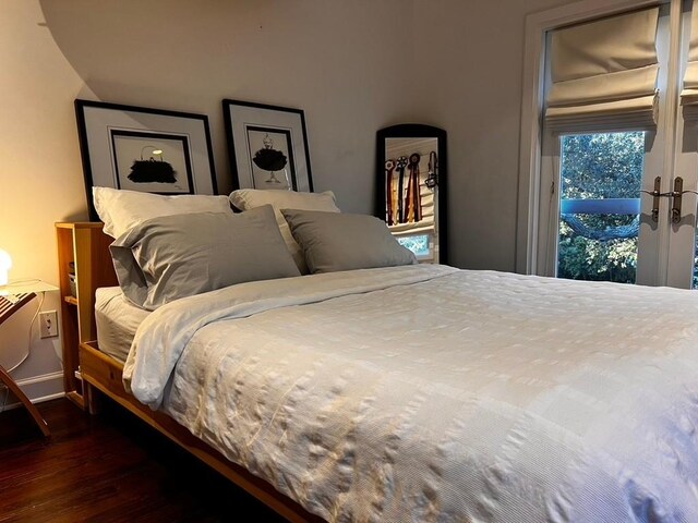 bedroom featuring dark wood-type flooring