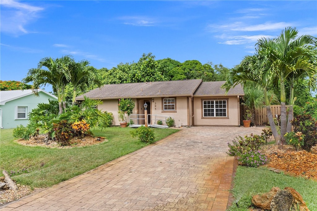 ranch-style house with a front yard