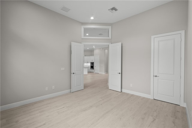 unfurnished bedroom featuring light hardwood / wood-style floors