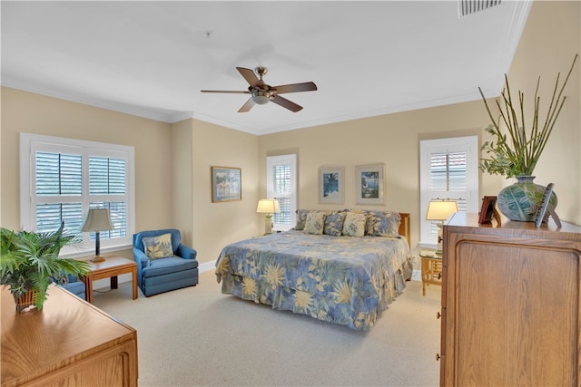 bedroom with crown molding, light carpet, multiple windows, and ceiling fan