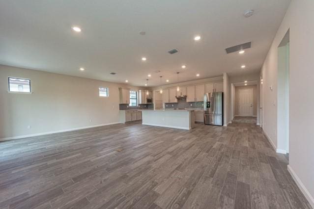 unfurnished living room featuring dark wood-type flooring