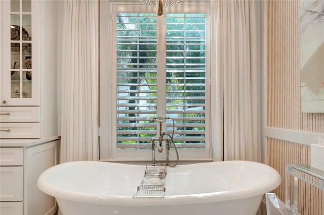 bathroom featuring a washtub