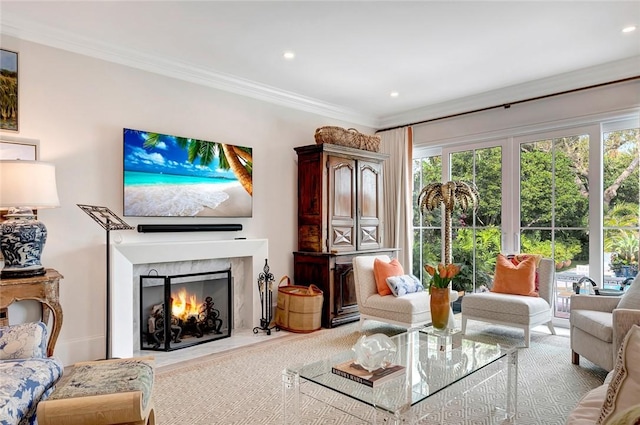 living room with crown molding and a fireplace