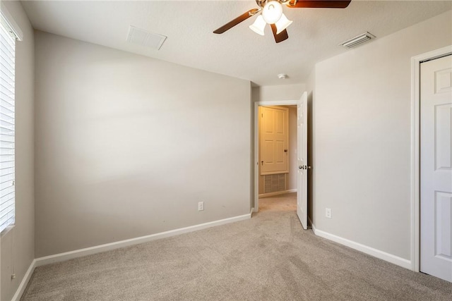 8157 Westfield Cir, Vero Beach, FL 32966 - unfurnished bedroom featuring baseboards, visible vents, and light colored carpet