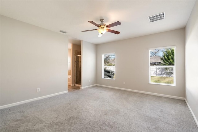 8157 Westfield Cir, Vero Beach, FL 32966 - carpeted empty room with a ceiling fan, visible vents, and baseboards