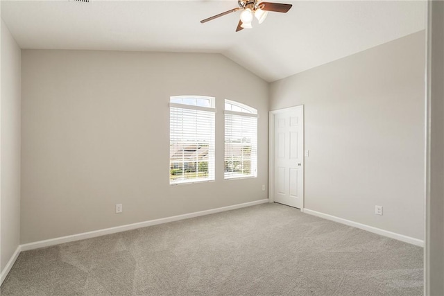 8157 Westfield Cir, Vero Beach, FL 32966 - empty room with vaulted ceiling, ceiling fan, baseboards, and light colored carpet
