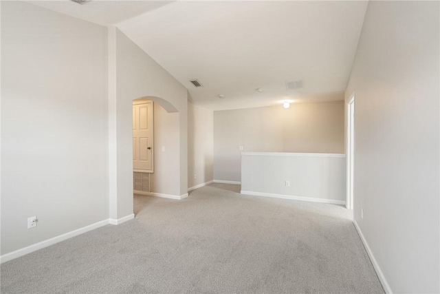 8157 Westfield Cir, Vero Beach, FL 32966 - unfurnished room featuring arched walkways, light carpet, visible vents, and baseboards