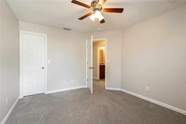 8157 Westfield Cir, Vero Beach, FL 32966 - unfurnished bedroom featuring ceiling fan, carpet floors, visible vents, and baseboards