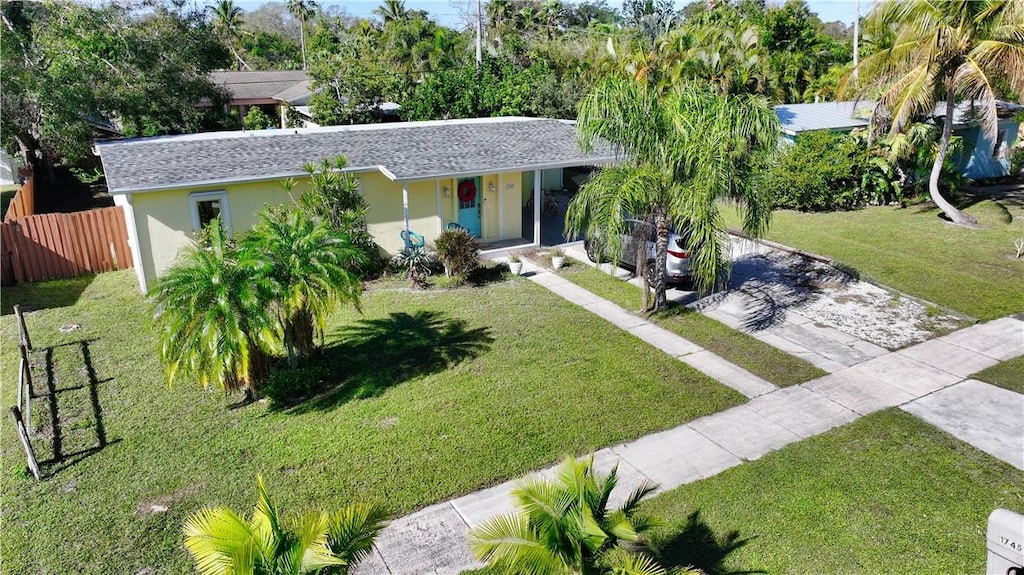 ranch-style house with a front yard