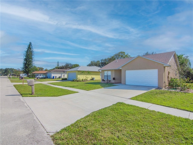 single story home with a front lawn and a garage