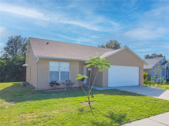 ranch-style house featuring a garage and a front yard