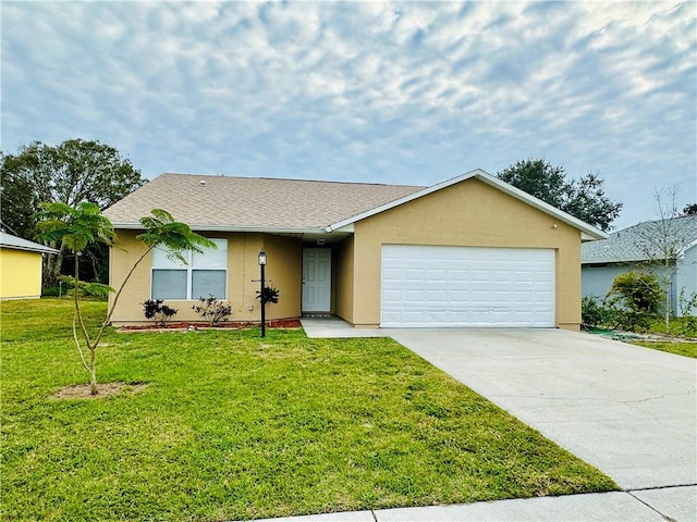 single story home with a garage and a front lawn