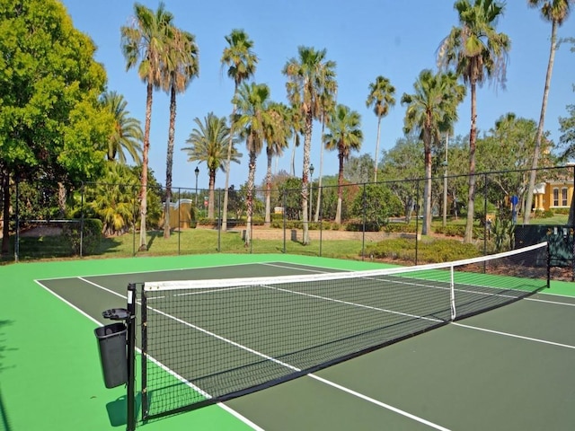 view of tennis court with fence