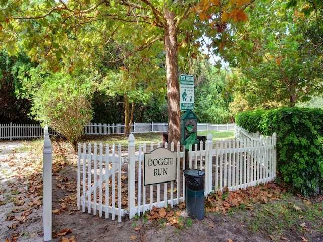 view of gate featuring fence