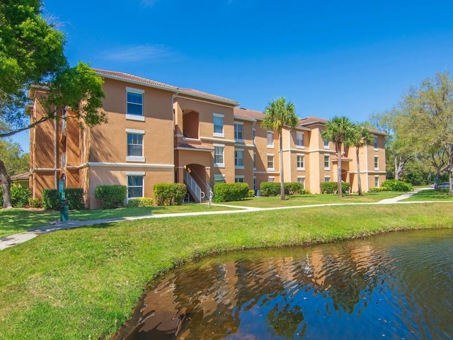 view of building exterior featuring a water view