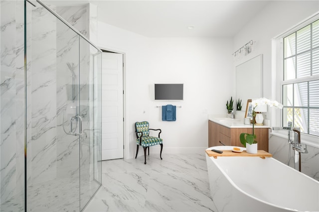 bathroom with vanity and independent shower and bath