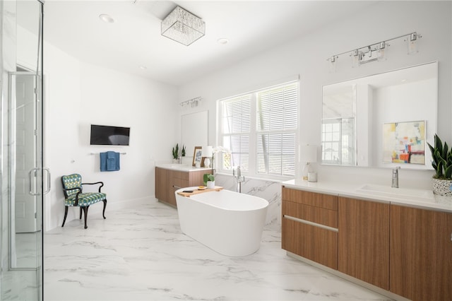 bathroom with vanity and independent shower and bath