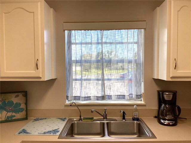 kitchen with sink and white cabinets