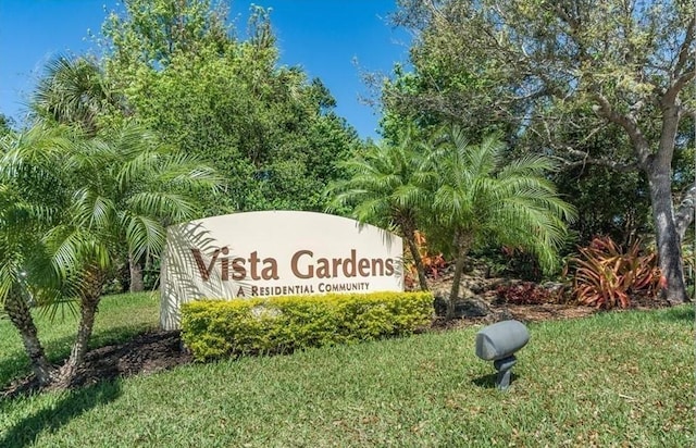 44 Vista Gardens Trail Trl Unit 101, Vero Beach, FL 32962 - community / neighborhood sign featuring a lawn