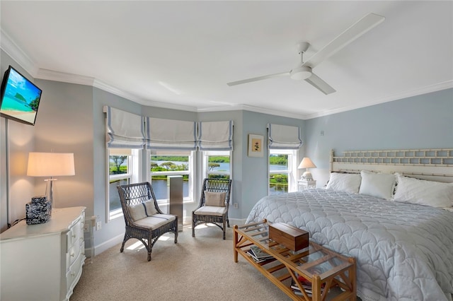 carpeted bedroom with ceiling fan and crown molding