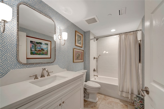 full bathroom with vanity, tile patterned floors, toilet, and shower / tub combo