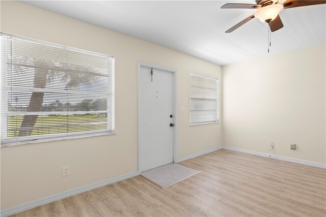 foyer featuring light wood-type flooring and ceiling fan