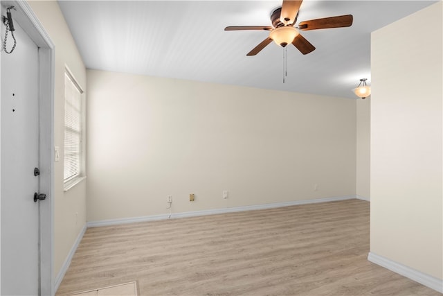 unfurnished room featuring ceiling fan and light wood-type flooring