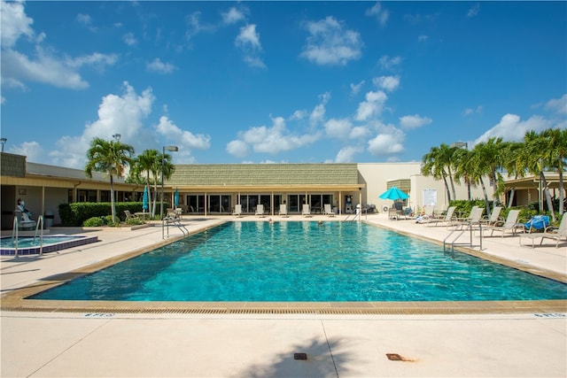 view of swimming pool with a patio area