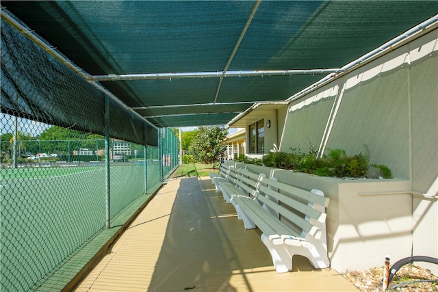 exterior space featuring tennis court