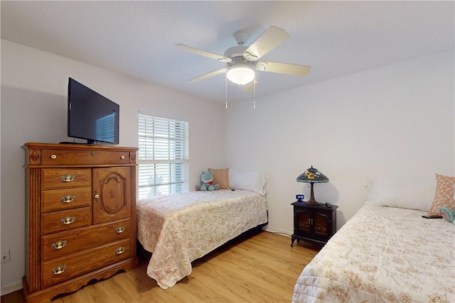 bedroom featuring ceiling fan and light hardwood / wood-style floors