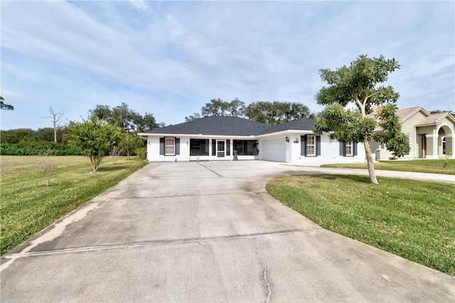 ranch-style home with a front yard and a garage