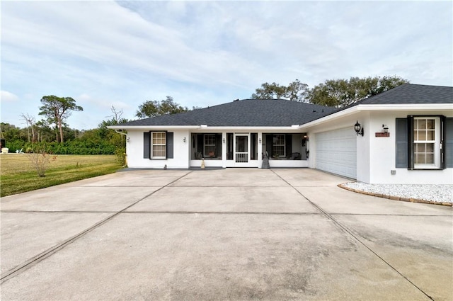 exterior space featuring a garage and a front yard