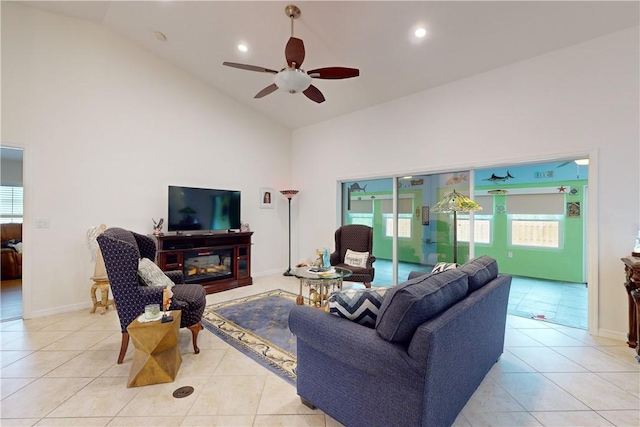 tiled living room with high vaulted ceiling and ceiling fan