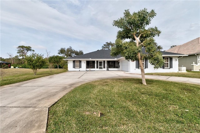 ranch-style home with a front lawn