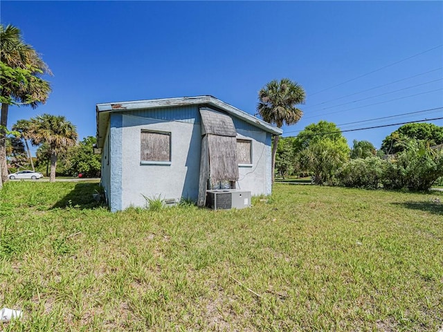 view of outbuilding featuring central air condition unit