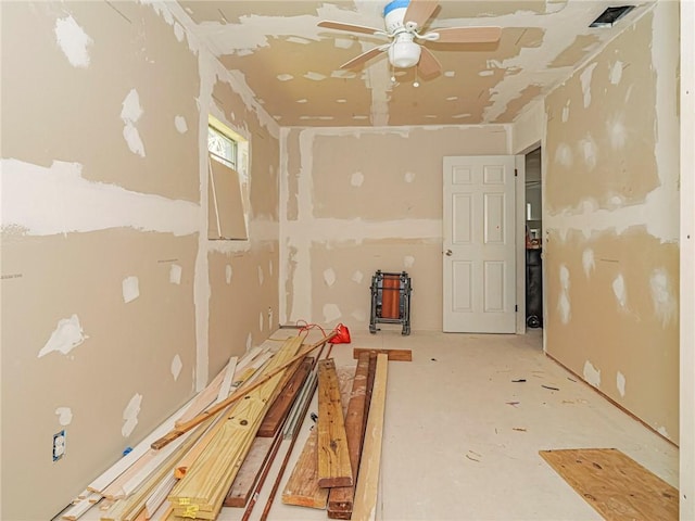 interior space with a ceiling fan and visible vents