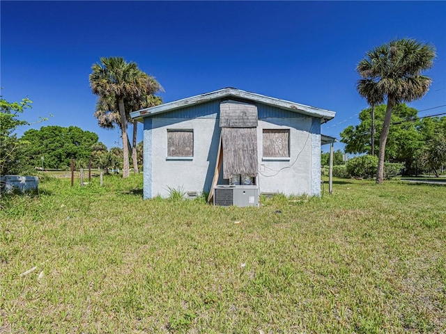 view of outbuilding featuring central AC