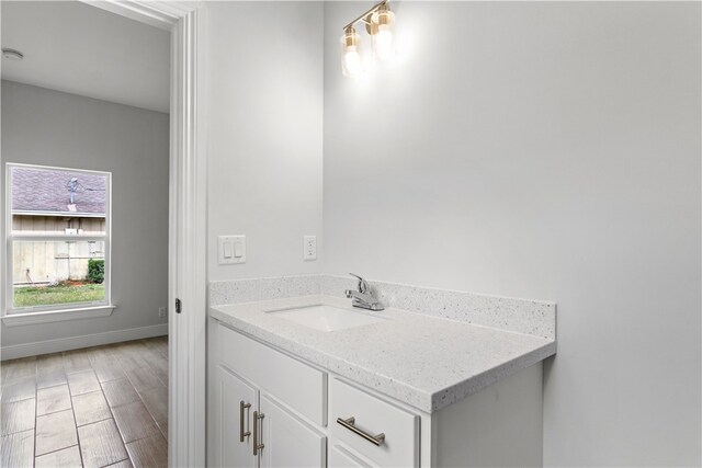 775 11th Ave SW, Vero Beach, FL 32962 - bathroom with vanity and baseboards