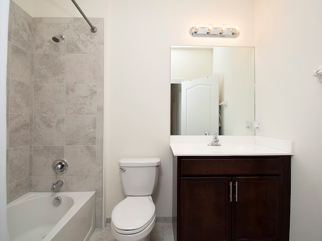 full bathroom with tile patterned floors, vanity, toilet, and tiled shower / bath