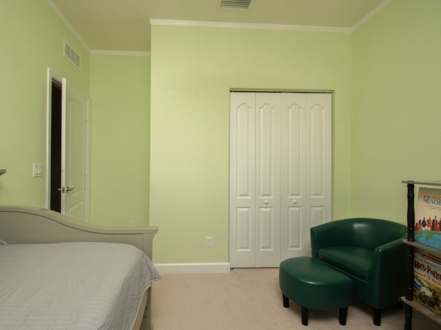 bedroom featuring light carpet, a closet, and ornamental molding