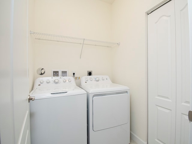 laundry room with washer and clothes dryer