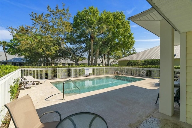 pool featuring a patio and fence