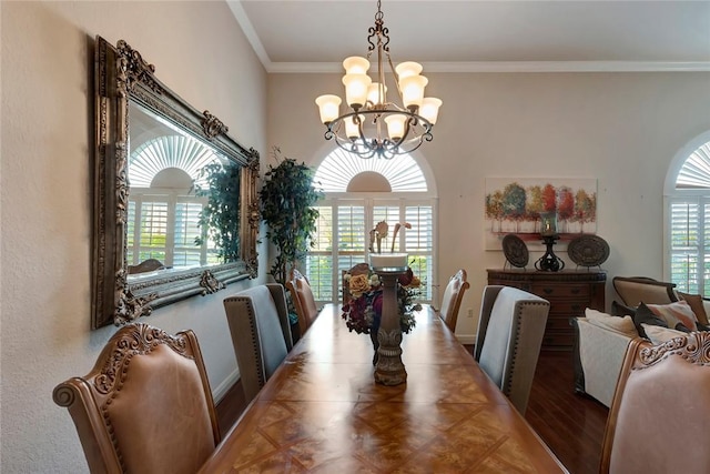 dining room with ornamental molding, hardwood / wood-style flooring, plenty of natural light, and a notable chandelier