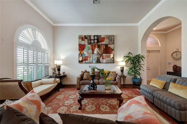 1781 Belmont Cir SW, Vero Beach, FL 32968 - living room with arched walkways, wood finished floors, plenty of natural light, and crown molding