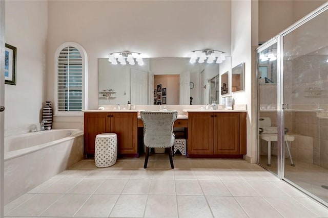 bathroom with tile patterned floors, vanity, and plus walk in shower